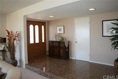Entry way.  Door to attached garage.