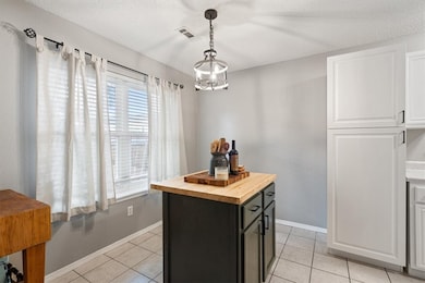 Kitchen Island adds to the ample counter space, and plenty of storage options.