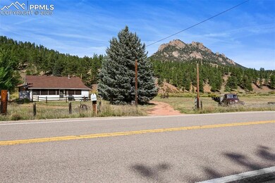Property view of mountains featuring a view of tre