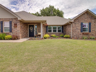 Ranch-style house with brick siding, a front yard,