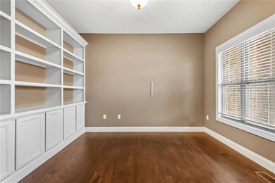 Office/Den featuring plenty of natural light and dark wood-type flooring