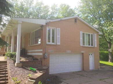 right side view with 2 car garage