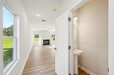 Corridor featuring light wood-type flooring and recessed lighting