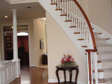 Foyer. two story with curved staircase...elegant!