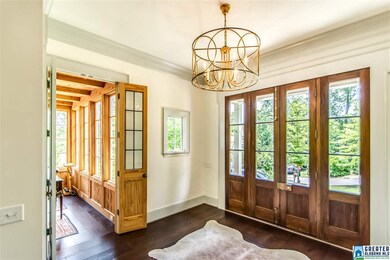 Leaded-glass, paned doors lead from foyer into stu