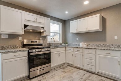 Updated cabinets, oven, vent, paint and lighting!