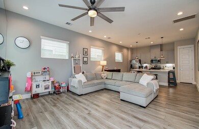 This spacious living area features an open floor p