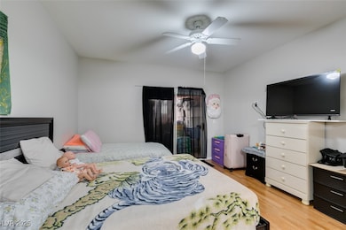 Bedroom featuring light wood-style flooring and a
