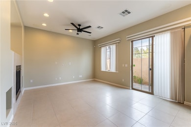 Unfurnished living room with ceiling fan, recessed