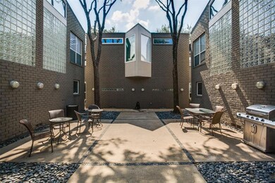 Courtyard with seating and community grill