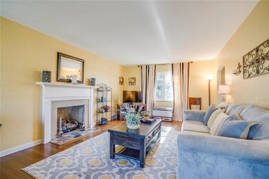 Large living room with fireplace.