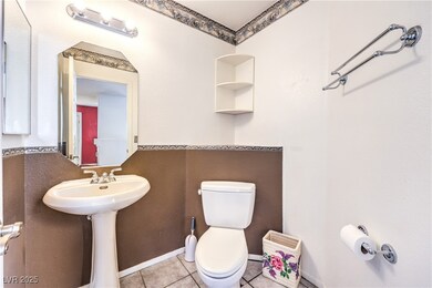 Half bath with tile patterned floors, baseboards,
