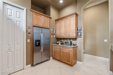 Kitchen featuring stainless steel refrigerator wit