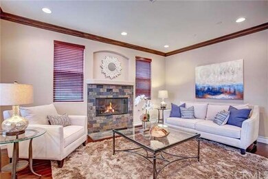 Formal living room with the 1st of 3 fireplaces.