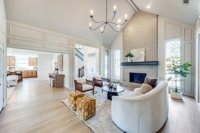 Living room featuring a fireplace, light wood-type