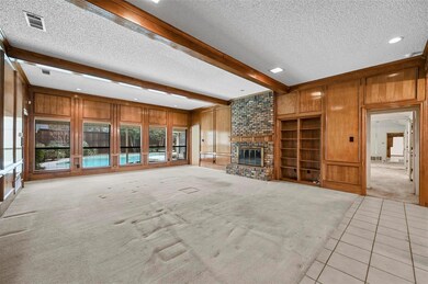 Unfurnished living room with beamed ceiling, wood 