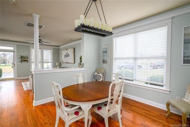 Dining room w/upgraded light, trim molding, big window w/2 inch blinds.