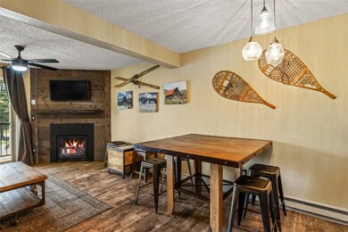 Dining area with a textured ceiling, a baseboard r
