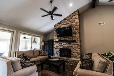 Stone to the ceiling fireplace that puts off a ton