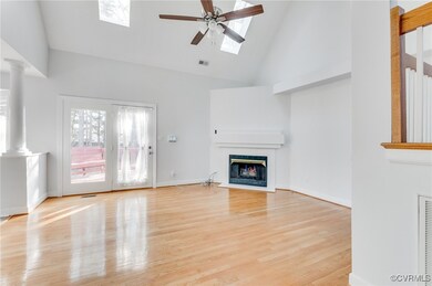 ornate columns, light hardwood, a skylight, high v