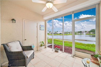 Sunroom / solarium featuring a water view, ceiling