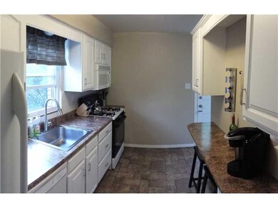 Kitchen. The galley kitchen is clean, bright and r