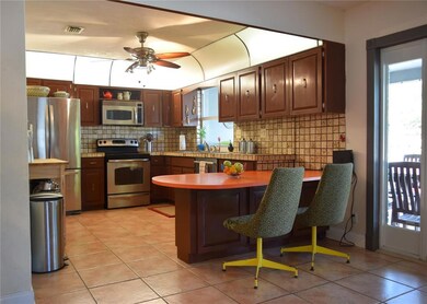 Large kitchen with real wood cabinetry and stainle