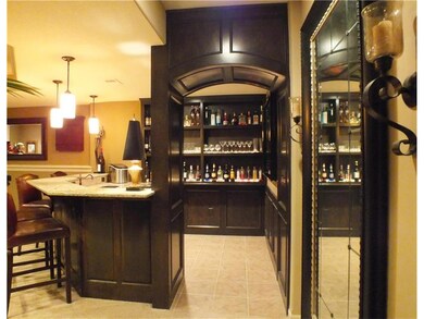 Custom wet bar with granite counter, mini frig, mi