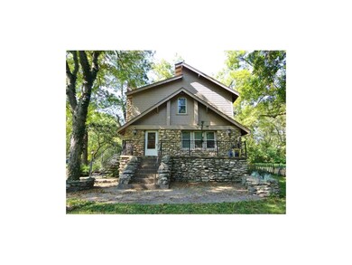 The front of this home offers an enclosed porch with a beautiful view of the surrounding acreage.