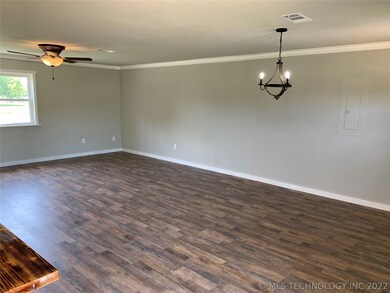 There is a dining area across from the kitchen wit