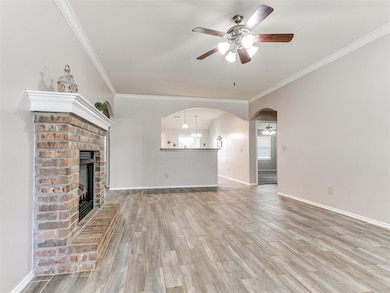 Unfurnished living room featuring crown molding, c