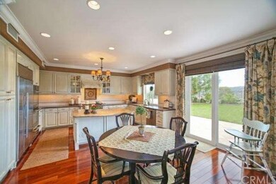 Spacious Breakfast Nook Features Custom Drapes, Mo