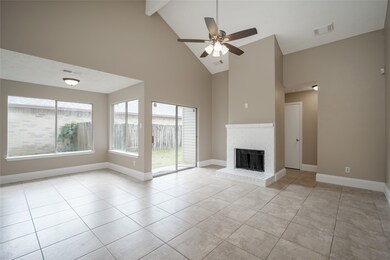 Drenched in light, this open floor plan is equipped with a wood burning fireplace