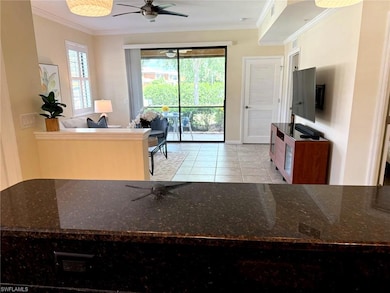 Kitchen featuring crown molding, light tile patter
