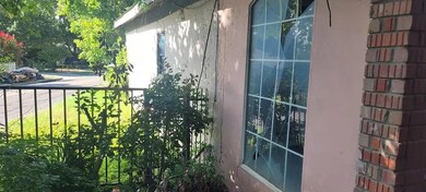 View of property exterior featuring a balcony