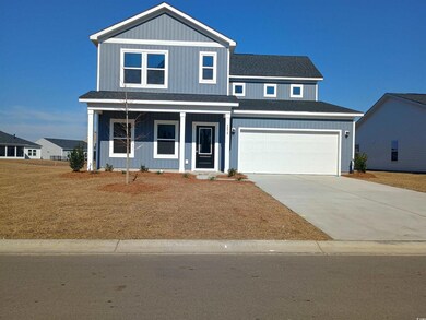 View of front facade with a porch, concrete drivew