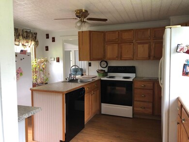 2a) Kitchen offers lots of cabinet space