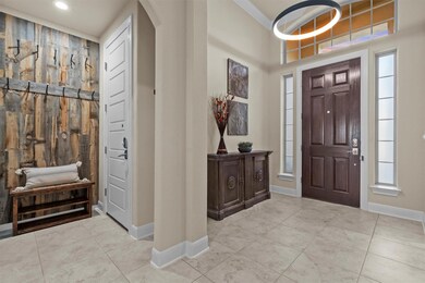 Foyer with arched walkways, light tile patterned 