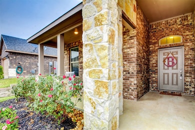 The beautiful stone and brick elevation and lush l