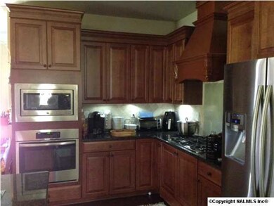 This is the same plan we built for someone else, Home currently being built will have similar color cabinets but will be glazed, Notice the full overlay soft close cabinets, GE Profile GAS cook top with Decorative direst vent range hood above
