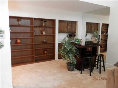 Built in bookcases & wet bar in living room.