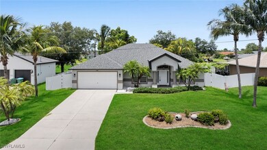 View of front of home featuring stucco siding, a g