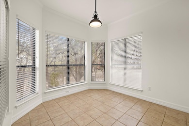 Unfurnished room with light tile patterned floori