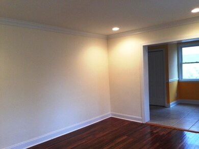 Spacious living room leads to dining area