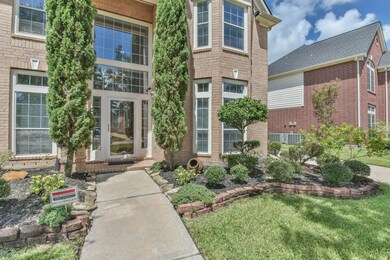 Beautiful front entry with oversized windows that allows for tons of natural light. The storm door is a great bonus, adding both extra security and extra insulation.