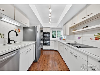 Real hardwood floors, a Euro-style kitchen, and thoughtful updates-including newer roof (2019), energy saver furnace and water heater, and dual-thermostat airflow-regulated four-season sunroom-set the stage for both daily living and entertaining.