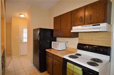 Kitchen has tile floors, new dishwasher, electric 