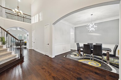Step into the formal dining room, where a sparklin