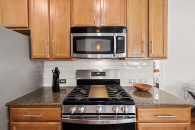 Kitchen with stainless steel appliances, tasteful