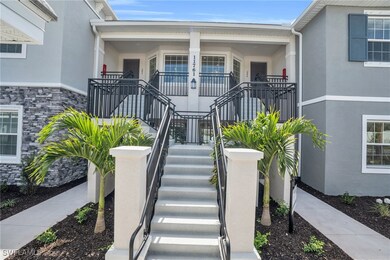 Property entrance with stucco siding, stone siding